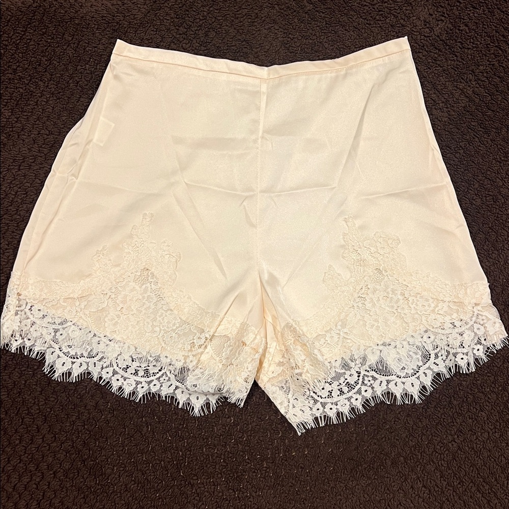 Low Rise Micro Mini Shorts. Color: Cream. Side zipper